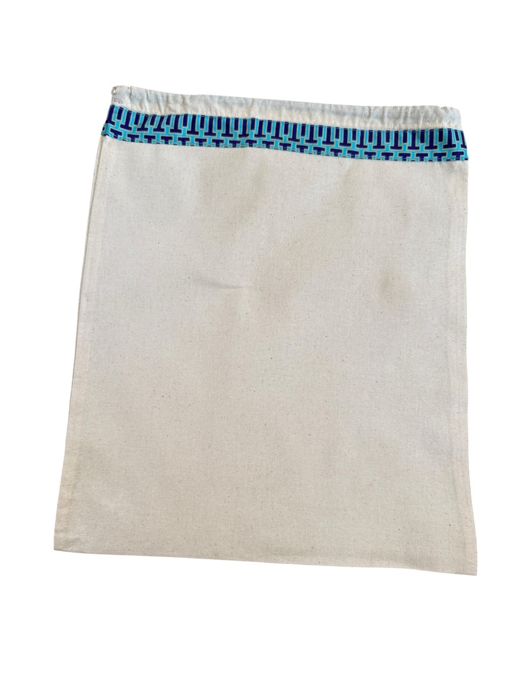 Tory Butch drawstring dust bag in cream color with T charm with logo
